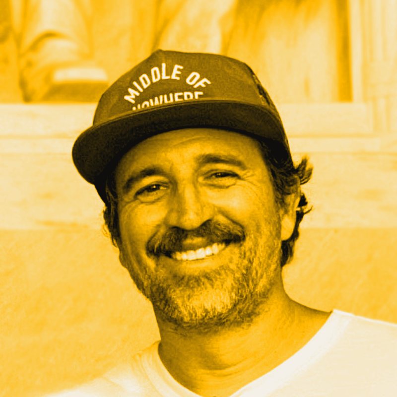 Justin smiling in a Middle of Nowhere hat, allegedly the original